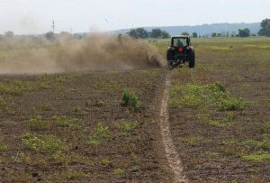 Offset Rotary Ditcher digging trench