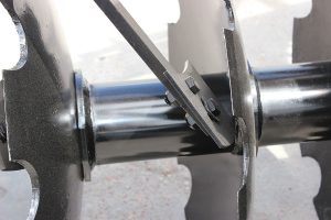Closeup of F41 Wheel Offset Harrow steel spacer scraper