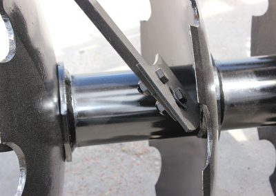 Closeup of F41 Wheel Offset Harrow steel spacer scraper