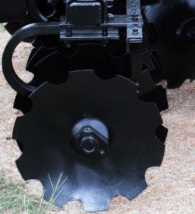 Closeup of F42 Wheel Offset Harrow shock absorber