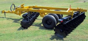 Side view of F42 Wheel Offset Harrow with tongue jack and hydraulic hoses