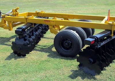 Side view of F42 Wheel Offset Harrow with tongue jack and hydraulic hoses
