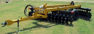 Side view of F42 Wheel Offset Harrow with tongue jack and hydraulic hoses