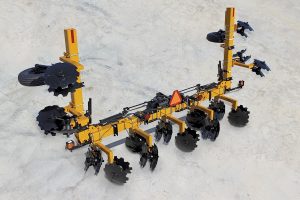 Aerial view of folded 8-row toolbar with bedding hipper assemblies