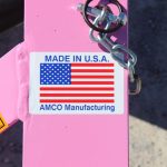 Made in U.S.A. sticker on pink AMCO equipment