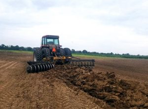 Terracing Plow in field with tractor