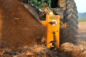Closeup of Dominator Vertical Rotary Ditcher in the field