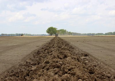 Straight-on view of a levee being build with AMCO LJ6 Levee Plow