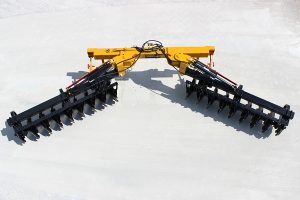 Overhead view of AMCO TJ3 Terracing Plow with parking stands on concrete