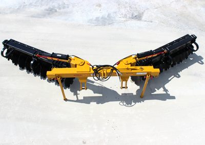 Overhead view of AMCO TJ3 Terracing Plow with parking stands on concrete