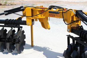 Closeup view of AMCO TJ3 Terracing Plow with parking stands on concrete