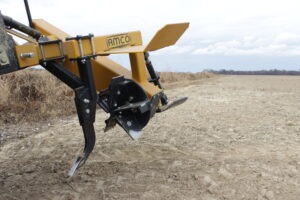 Closeup of Offset Rotary Ditcher raised in the field
