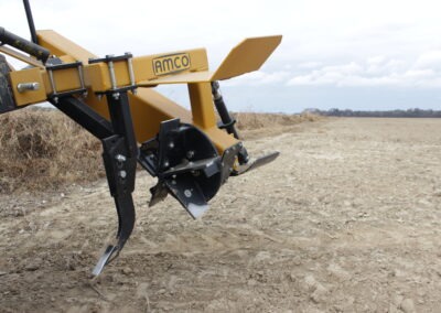 Closeup of Offset Rotary Ditcher raised in the field