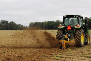Vertical Rotary Ditcher in field digging trench