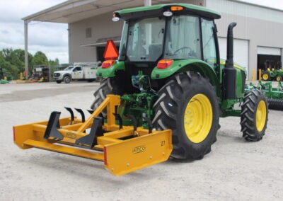 Z-7 with scarifiers installed on John Deere tractor on AMCO lot