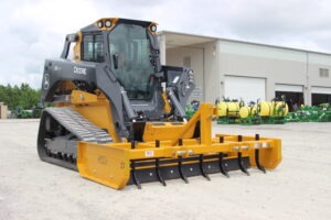 Z-7 with scarifiers installed on John Deere skid steer on AMCO lot