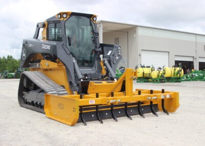 Z-7 with scarifiers installed on John Deere skid steer on AMCO lot