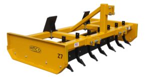 Side view of Z-7 Z-Blade with scarifiers and skid steer adapter installed